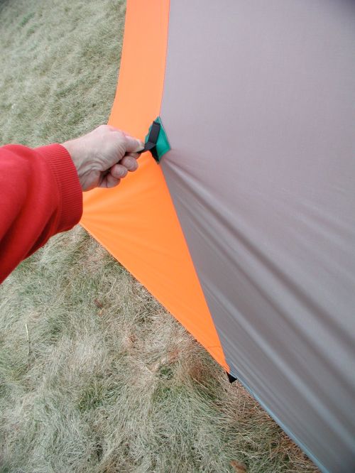 Additional tie outs can be staked around the hem and the upper center tie outs can be used to gain headroom in windy or heavy snow conditions.