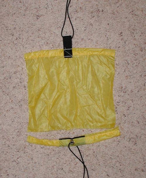 grommet held while hem tore at stitch line. Unreinforced 1" web tie out with top of stitching past hem stitch held.