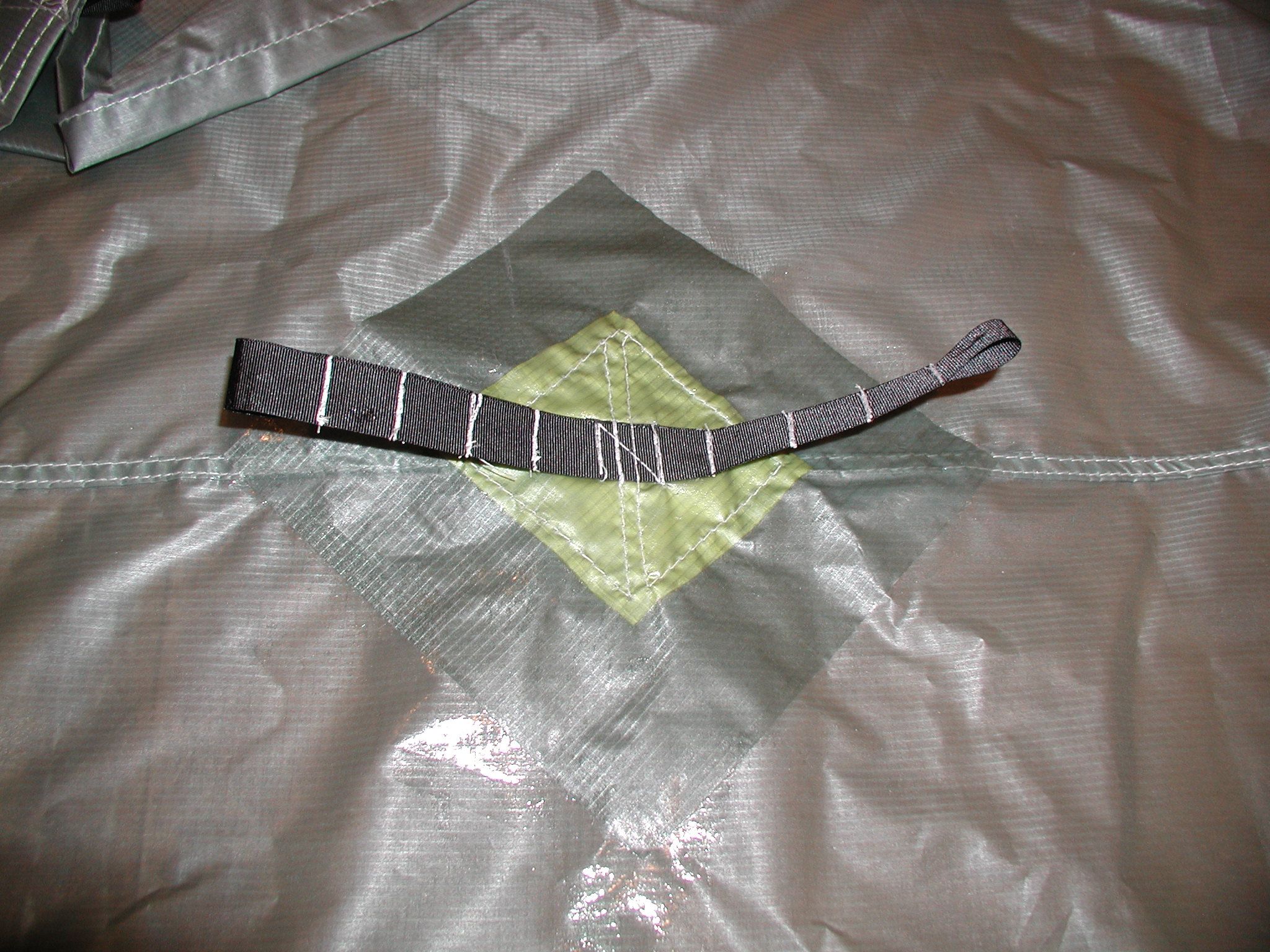 patch for holding paddle or pole under tarp on silicone coated ultralight nylon